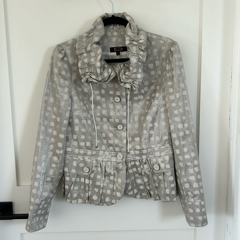 Stunning silver and cream ruffle neck and hem jacket. Made in Canada